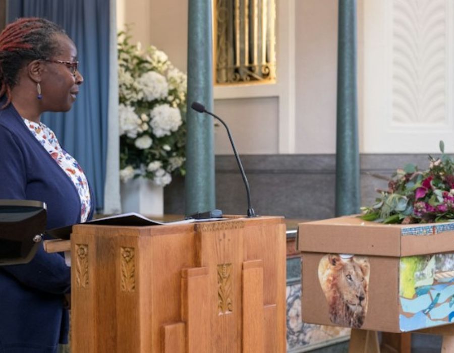 a woman reading a  Customized Funeral Speech
