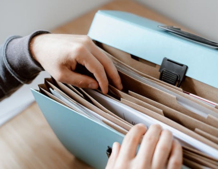 a person going through different kinds of documents