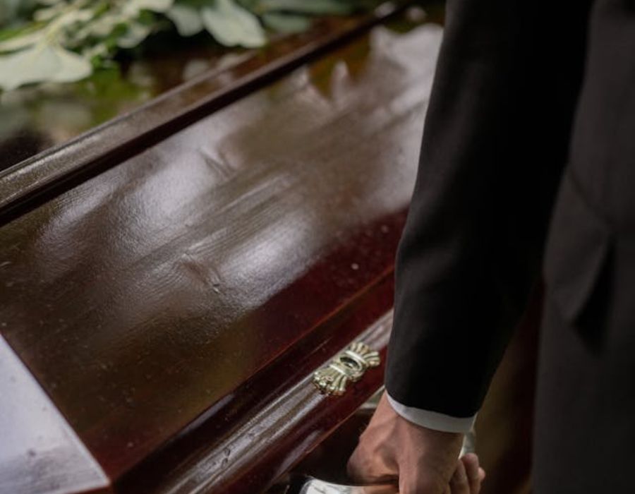 a man holding a casket